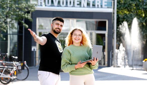 students standing at the mainentrance