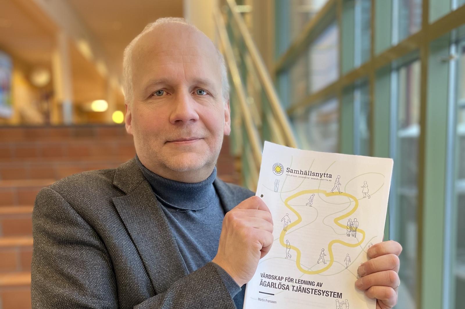 Photo of a man with a report