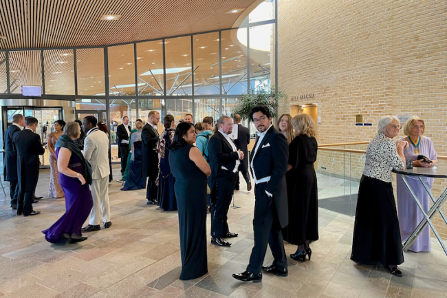 Gathering in the Aula Magna foyer before the ceremony