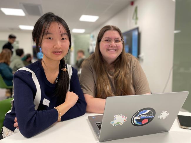 Two girls by a computer