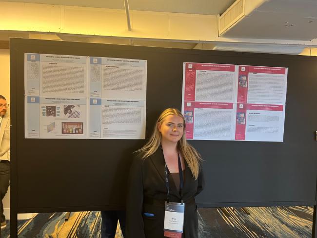 Woman in front of reserach posters